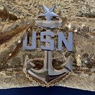 USN anchor emblem on a gold sequin background