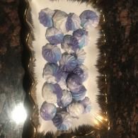 White rectangular tray with purple-blue flowers arranged on it
