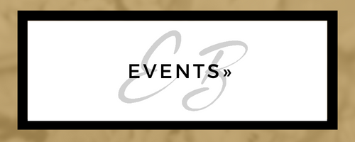 Black-framed sign reading “EVENTS” over a light beige background with gray swirl accents