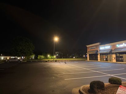 White parking lines on a dark asphalt road