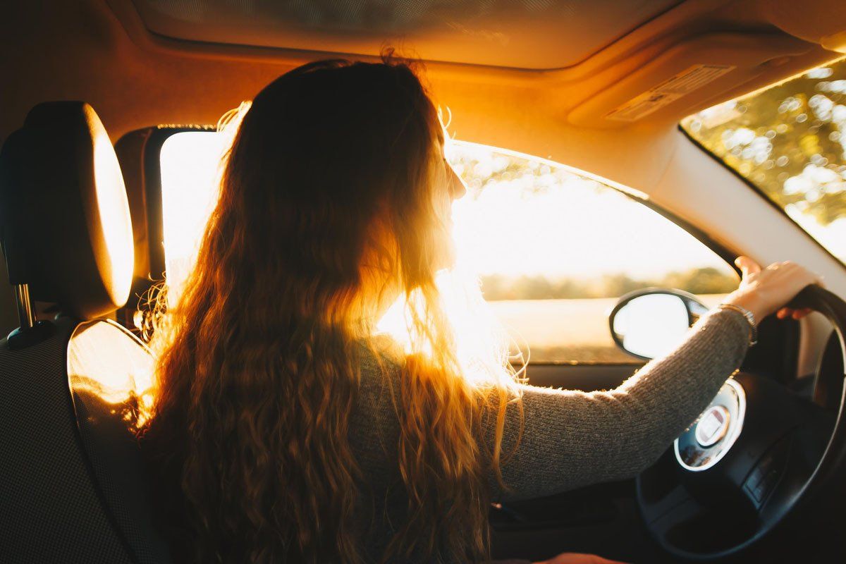 woman driving a fiat 500
