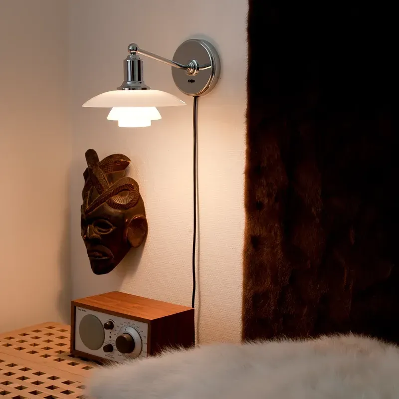 showroom Louis Poulsen lampade da parete Colombo Illuminazione zona notte Novara