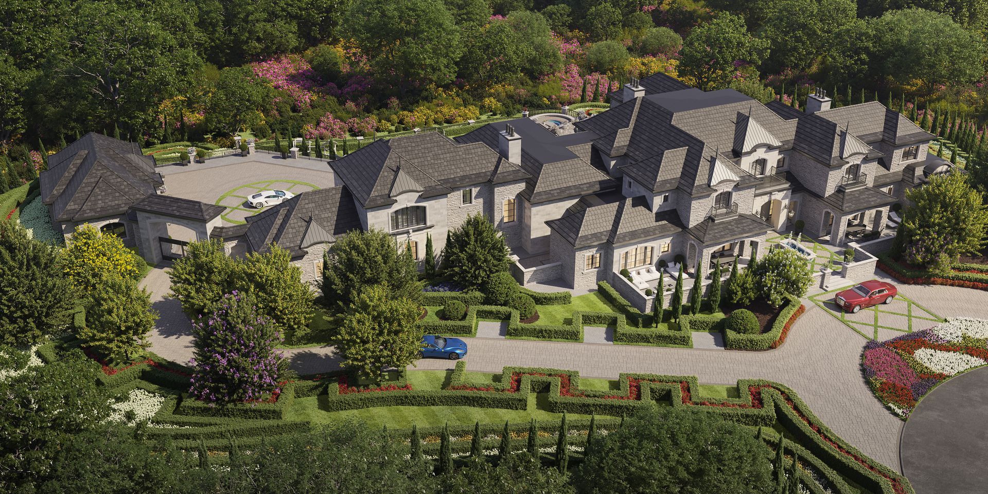 An aerial view of a large house surrounded by trees.