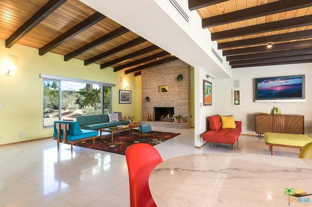 A living room filled with furniture and a fireplace