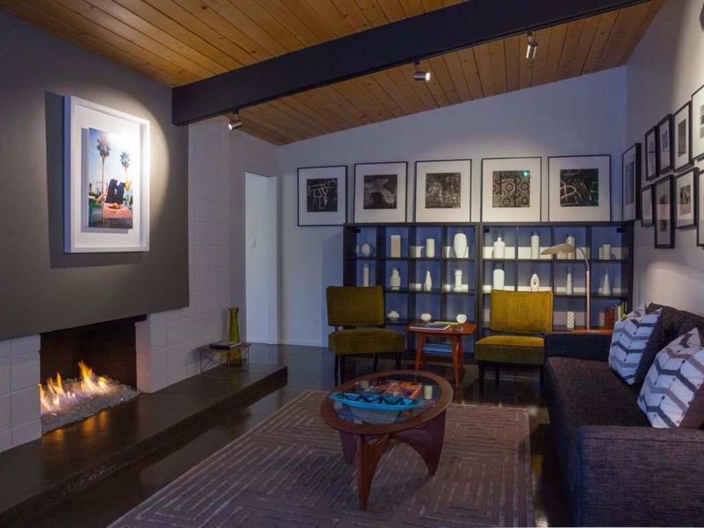 A living room with a fireplace and a couch