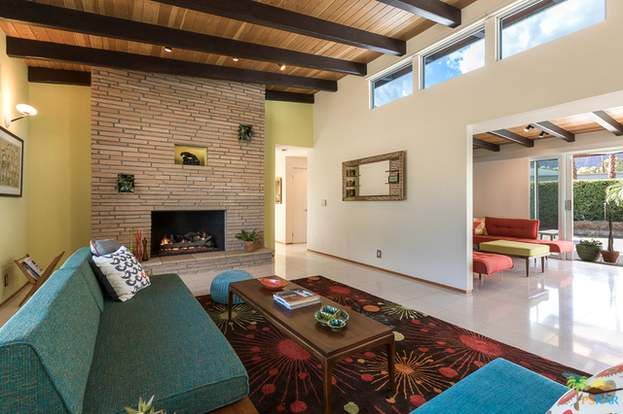 A living room with a fireplace and a couch