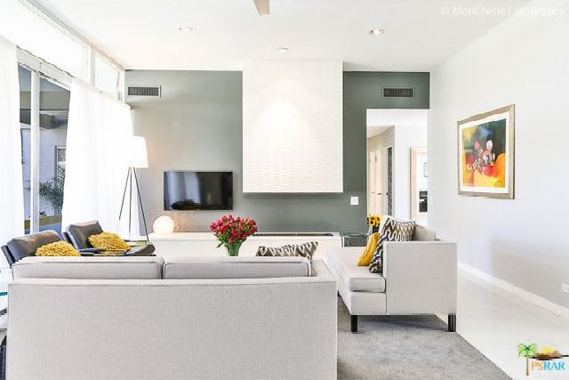A living room filled with furniture and a flat screen tv.