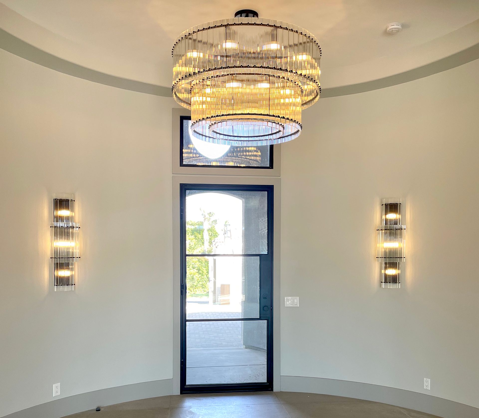 A room with a large chandelier hanging from the ceiling