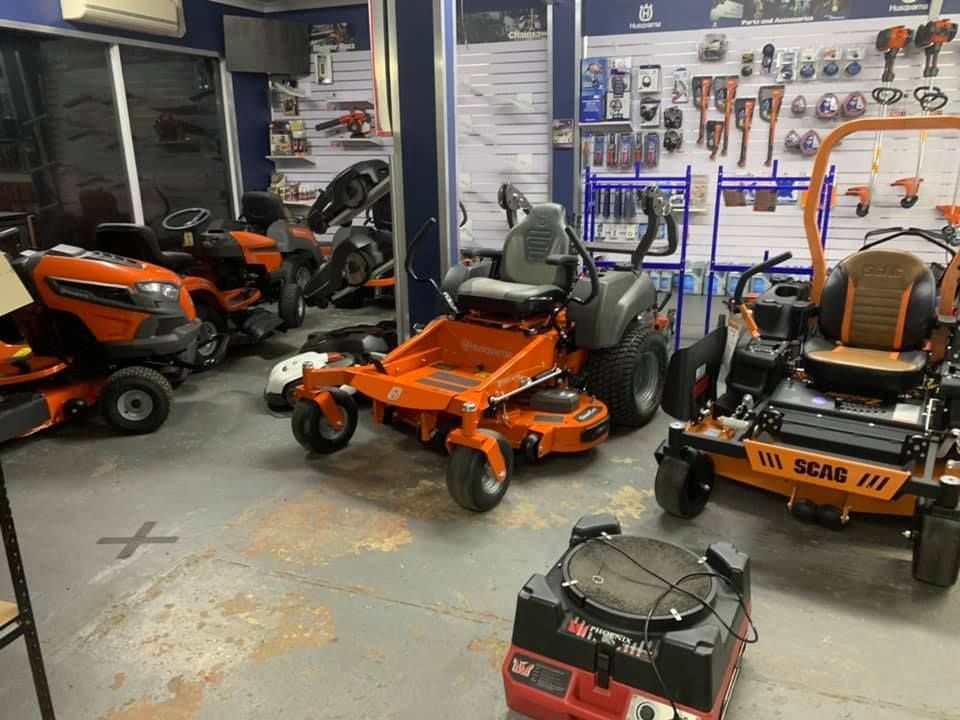 A Room Filled With Lawn Mowers And Tractors — Mid Coast Mowers In Taree, NSW