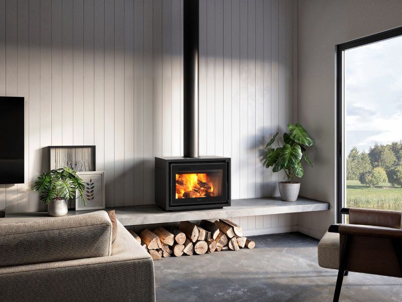 A Fireplace With A Basket Of Logs Next To It — Mid Coast Mowers In Taree, NSW