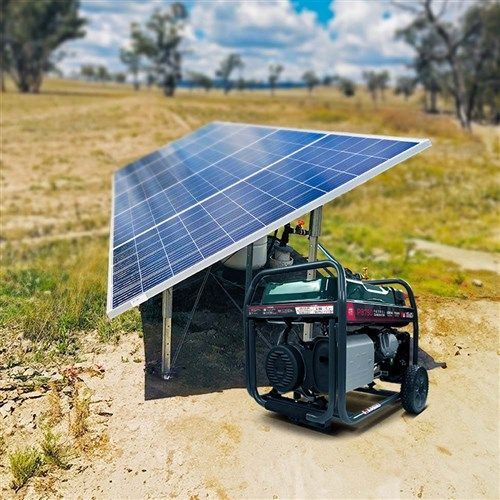 A Red Generator Is Plugged Into A Power Cord On A Sidewalk — Mid Coast Mowers In Taree, NSW