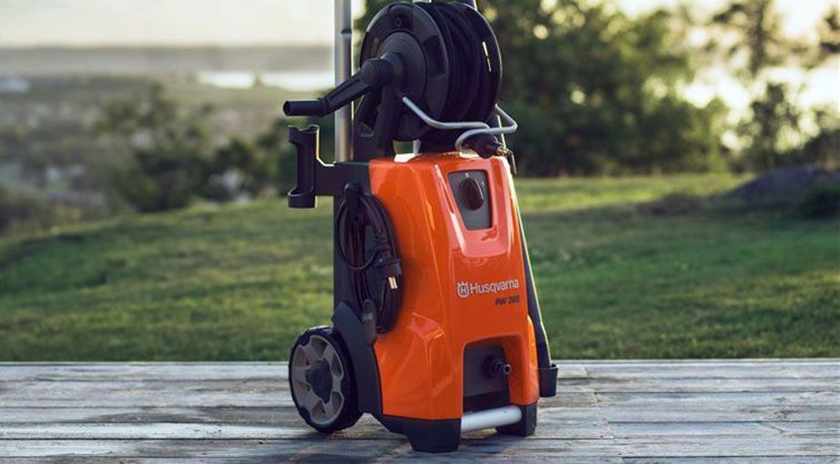 A Husqvarna High Pressure Washer Is Sitting On A Wooden Deck — Mid Coast Mowers In Taree, NSW