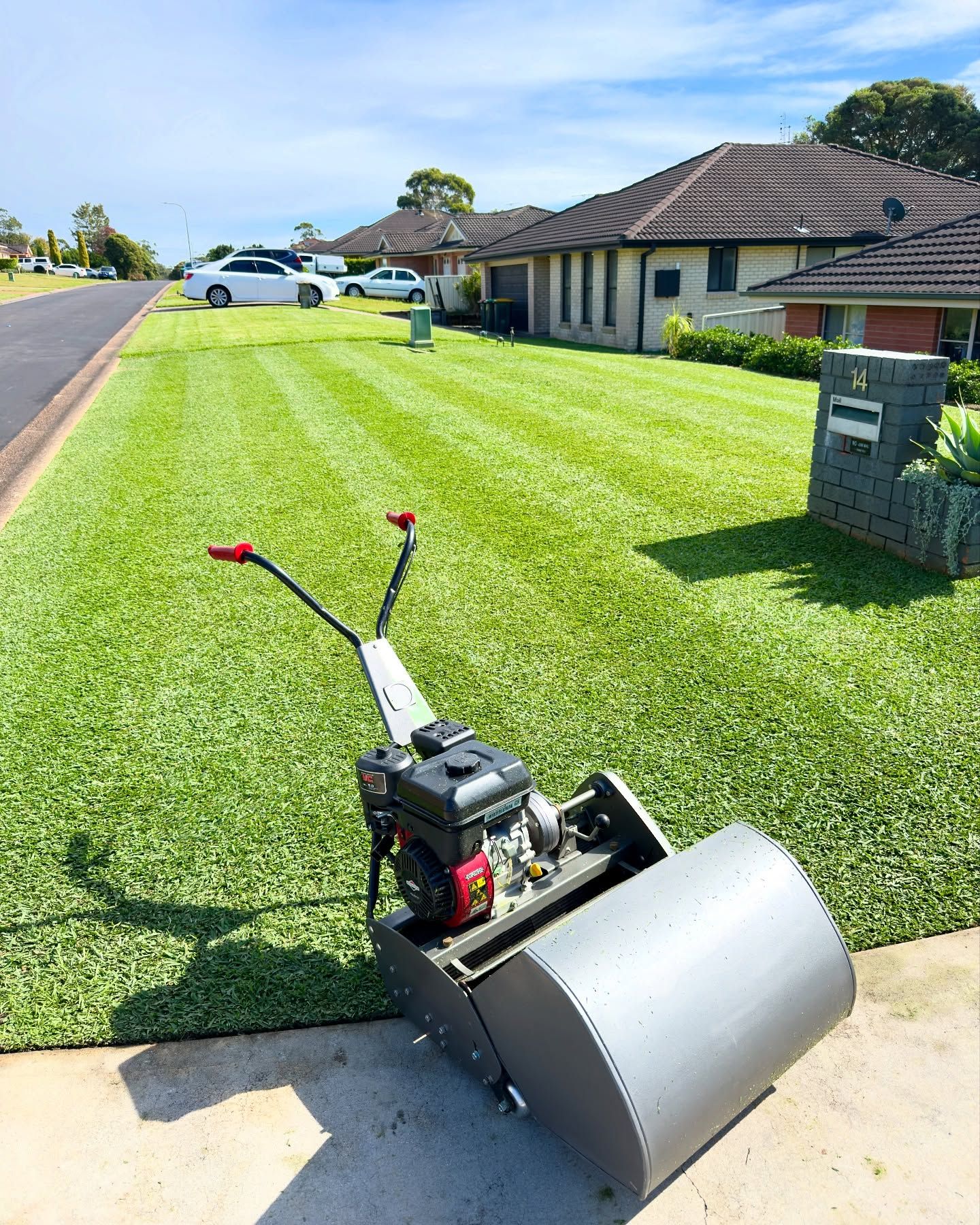 Lawnmower on a Manicured Lawn in a Suburban Setting — Mow & Mulch Lawn & Garden Maintenance In Corlette, NSW