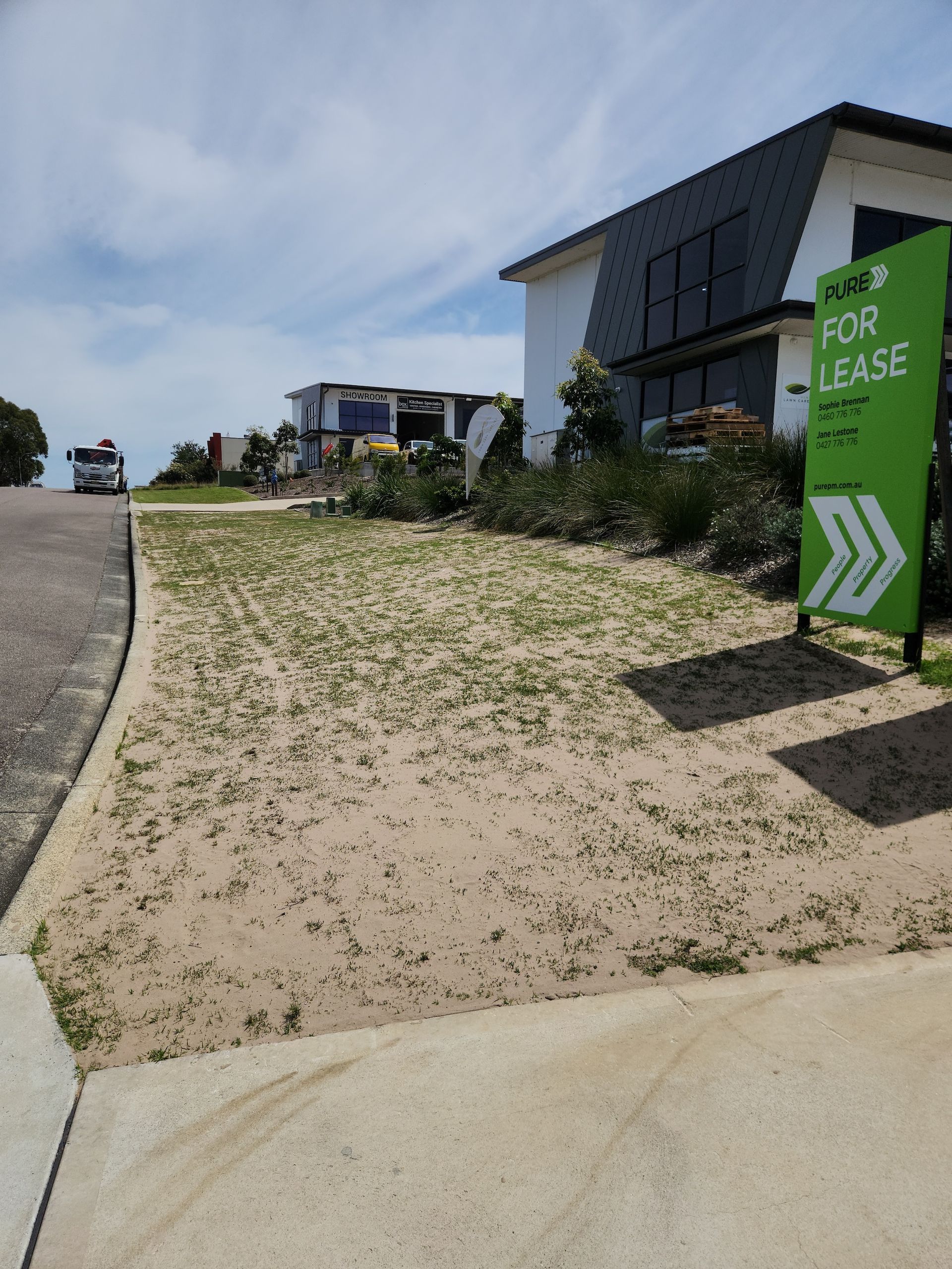 Green Grass Front yard Bordered on Suburban Street— Mow & Mulch Lawn & Garden Maintenance In Salamander Bay, NSW