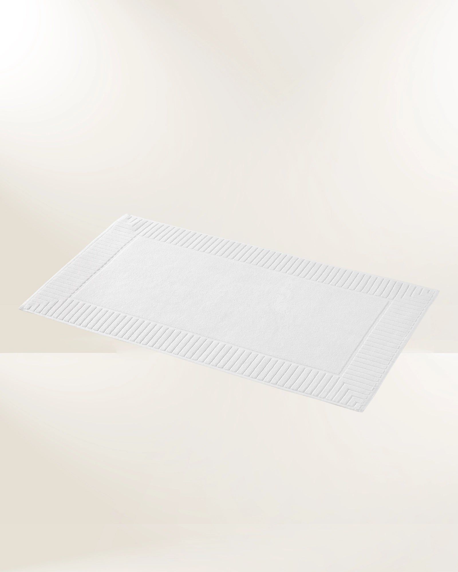 White textured rectangular mat on a light beige background