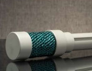 White cylindrical device with a teal textured grip on a reflective surface