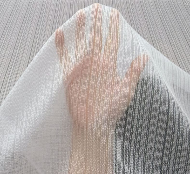 A hand pressed against a sheer white curtain, visible through the fabric.