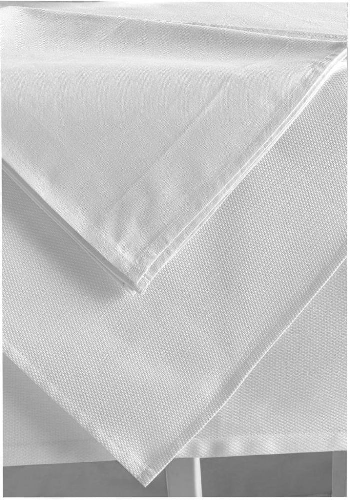 Close-up of folded translucent white textured fabric on a light background