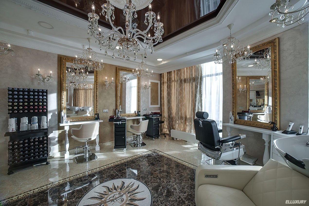 Elegant luxury salon interior with chandeliers, mirrors, styling chairs, and ornate decor