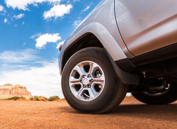 A silver Ute is parked on a dirt road — Dave's Used Cars In Stuart, NT