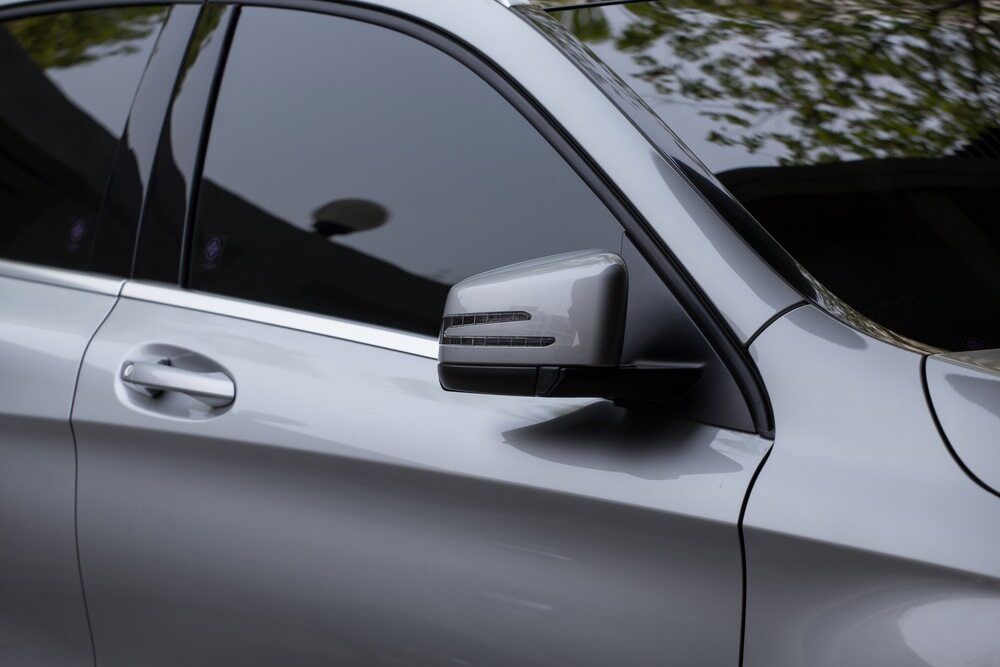 A Silver Car is Parked in Front of a Building — Dave's Used Cars In Stuart, NT
