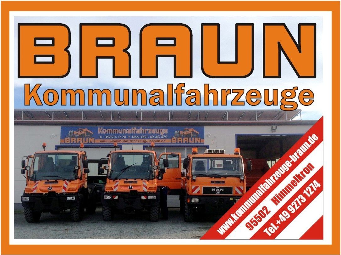 A sign for braun kommunalfahrzeuge with trucks in front of it