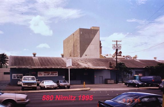 A photo of 580 nimitz in 1995 with cars parked in front of it