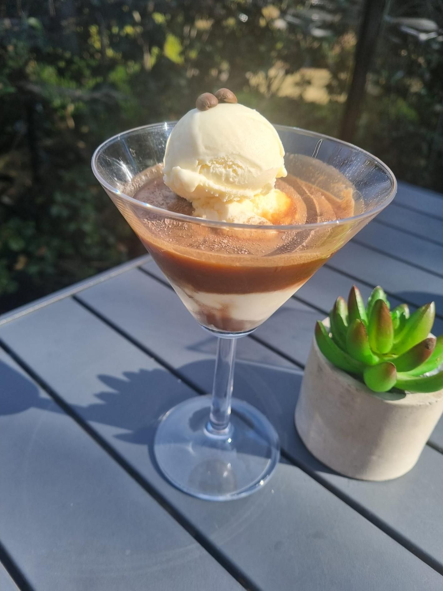 A Martini Glass Filled With Ice Cream And Chocolate Sauce On A Table — Top Point Café In East Gosford, NSW
