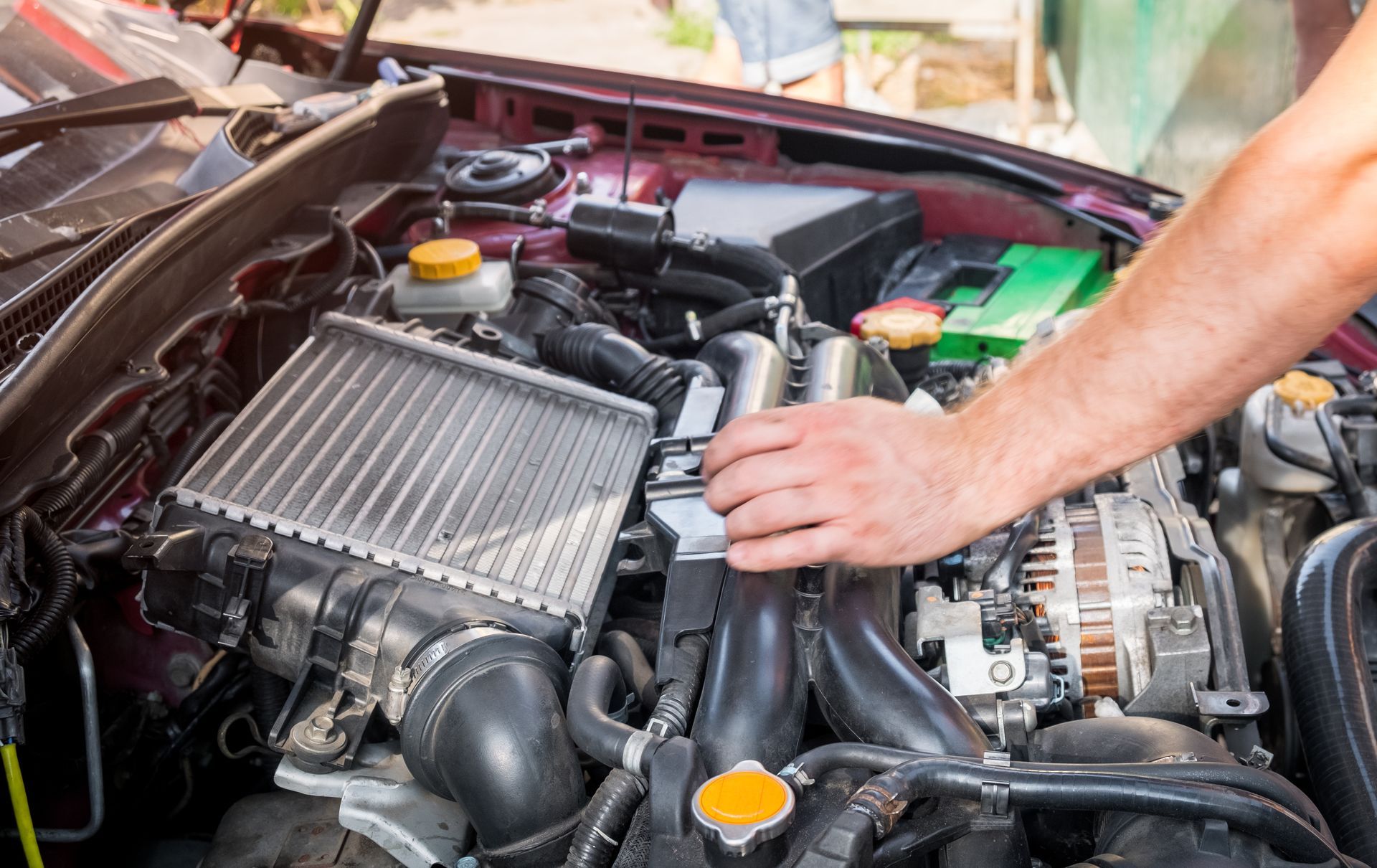 Mechanic working on engine | Agape Auto Repair