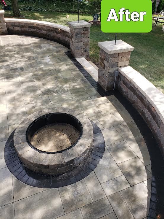 Circular stone fire pit on a paved patio with curved brick seating wall and the word “After” in the corner