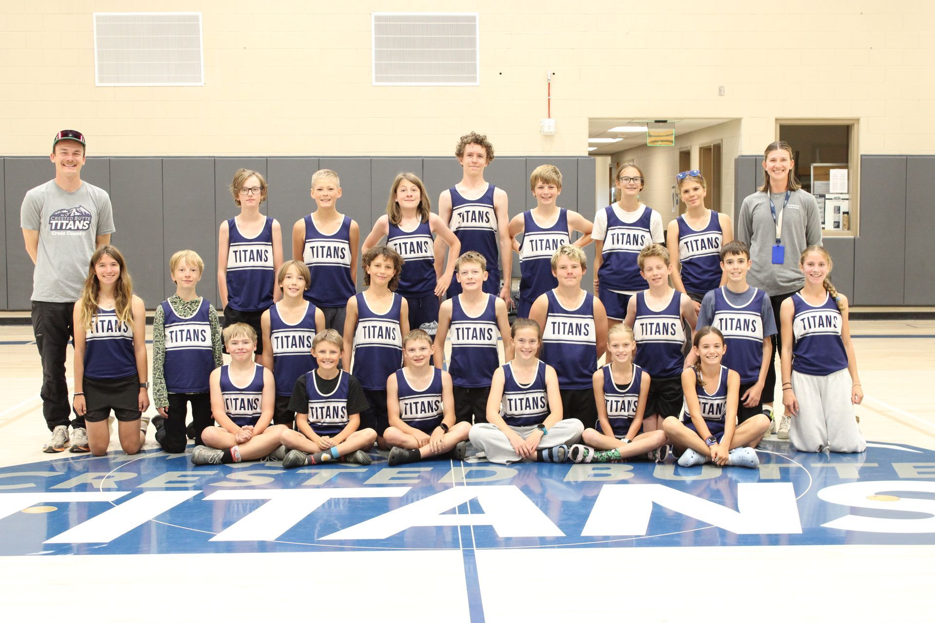 A group of young athletes are posing for a picture.