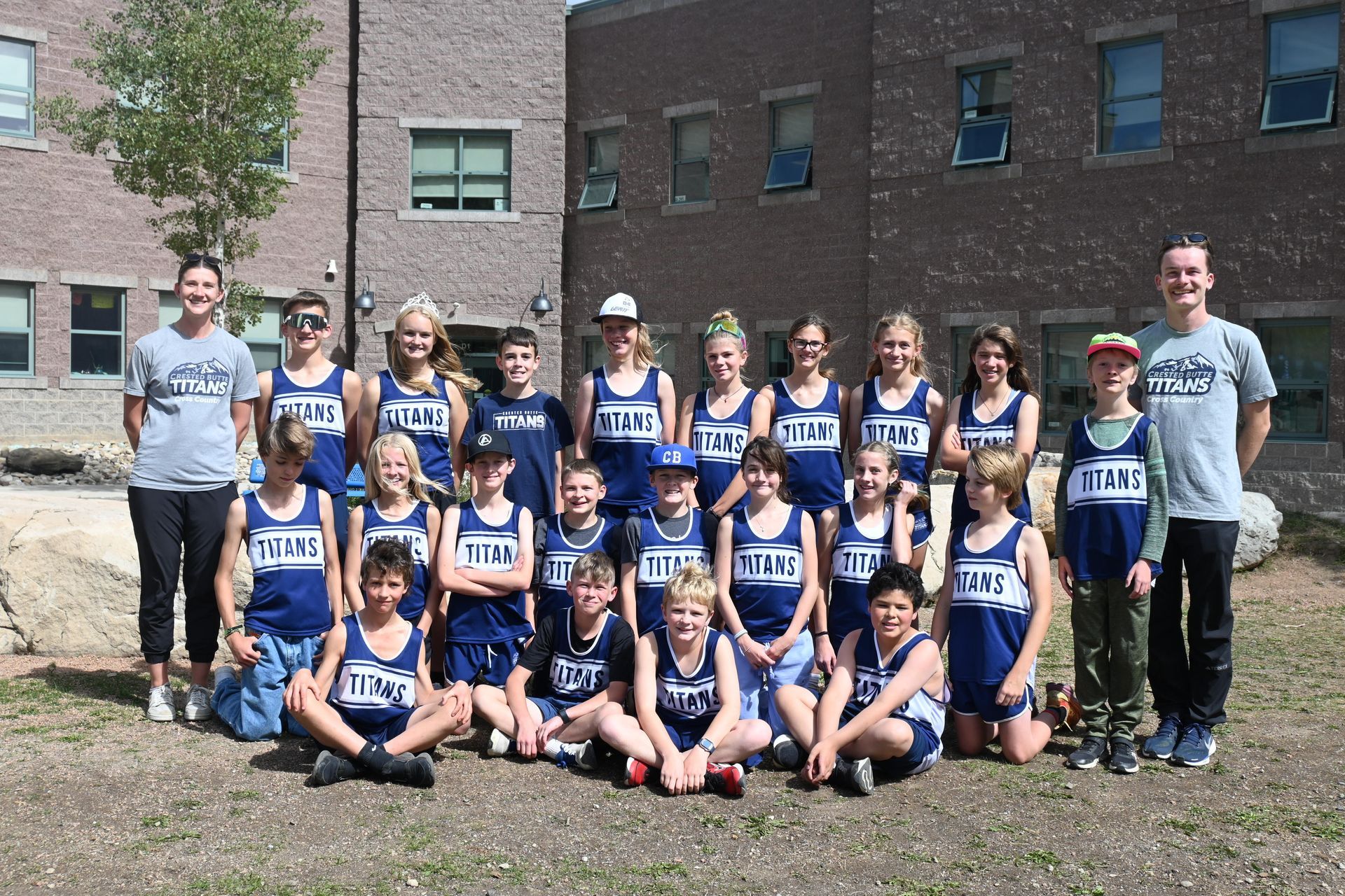 A group of young athletes are posing for a picture.