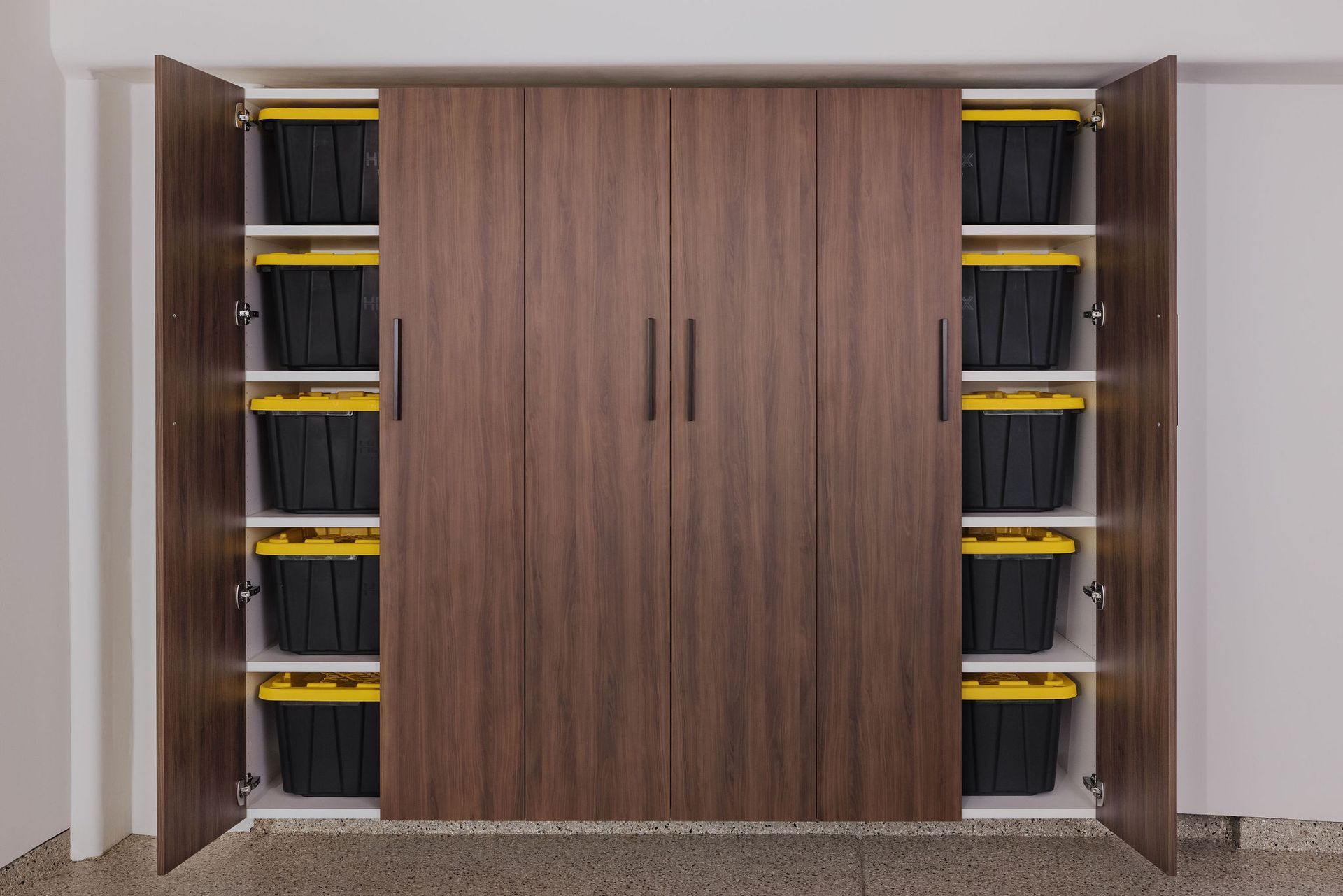 Wood-look storage cabinet with open side panels revealing shelves filled with black plastic bins with yellow lids.