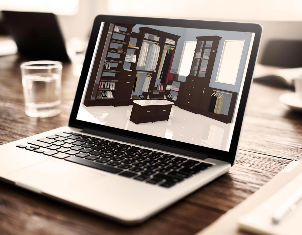 Laptop on a wooden desk displaying code, with a glass of water beside it