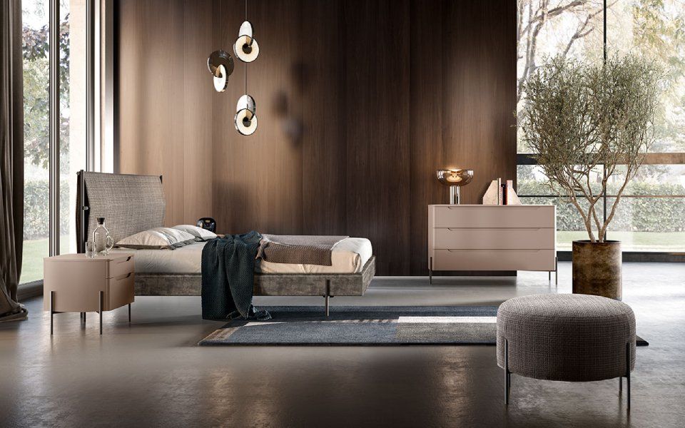 camera da letto moderna con parete in legno