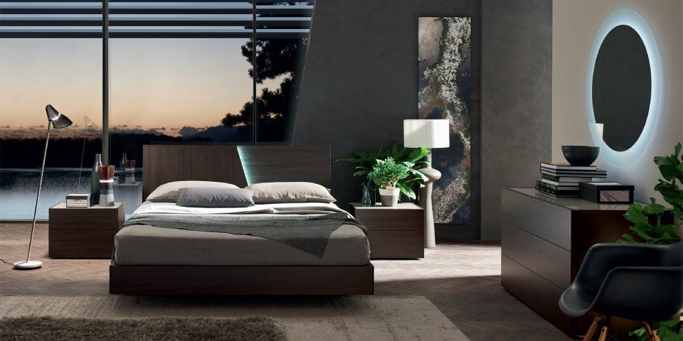 camera da letto moderna con arredi scuri