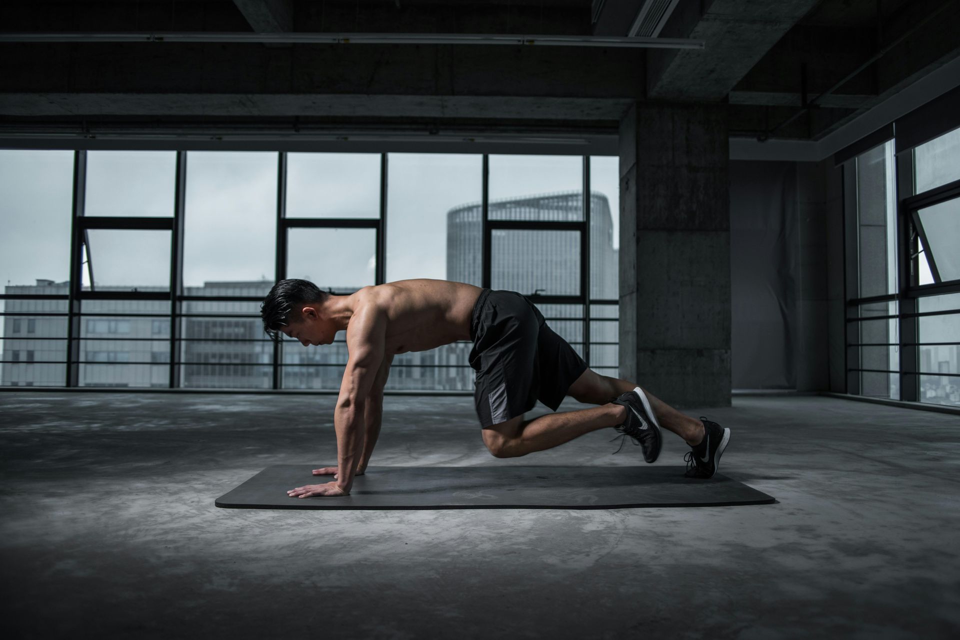 Man doing exercises indoors. 