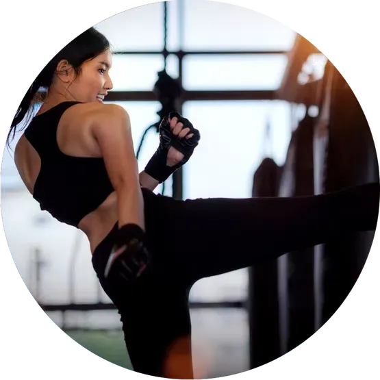 girl doing kickboxing on bags