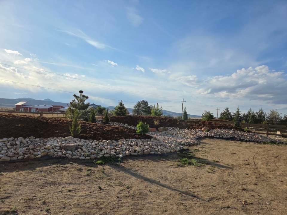 Landscaped yard with stone steps and retaining walls