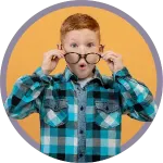 Child in a blue plaid shirt holding glasses on a yellow background