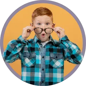 Child in a blue plaid shirt holding glasses on a yellow background