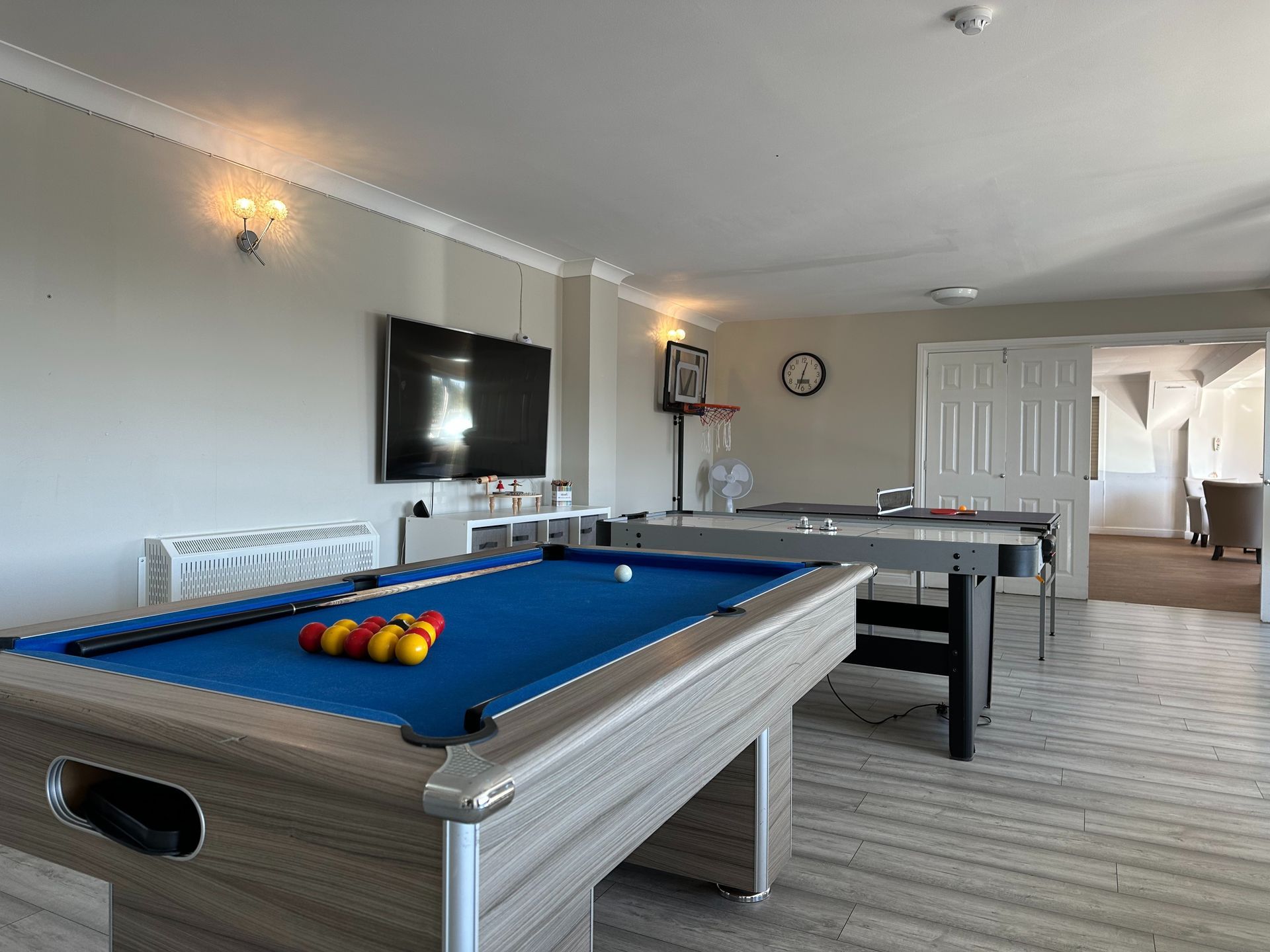 Interior Harbour care Lounge with pool table and TV