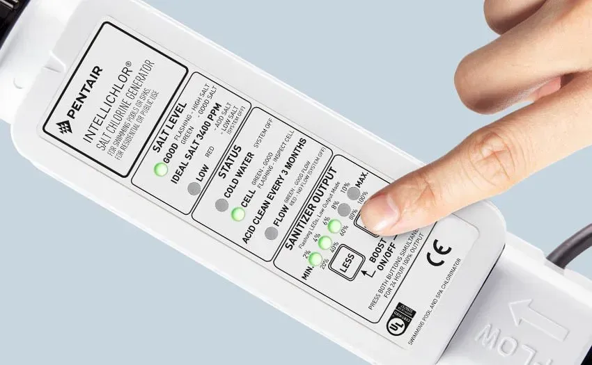 A person is pointing at a pentair label on a device