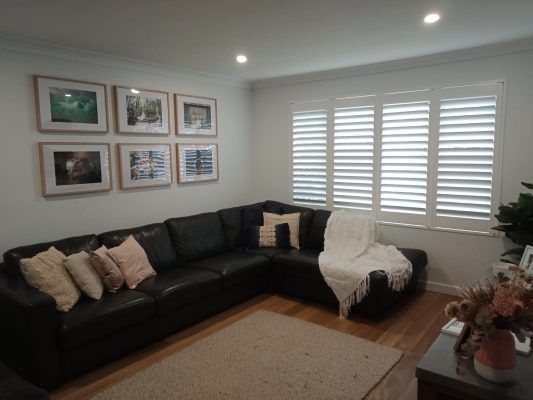 A Living Room With White Shutters — Ron Ayton Curtains, Blinds & Shutters In Shelly Beach, NSW