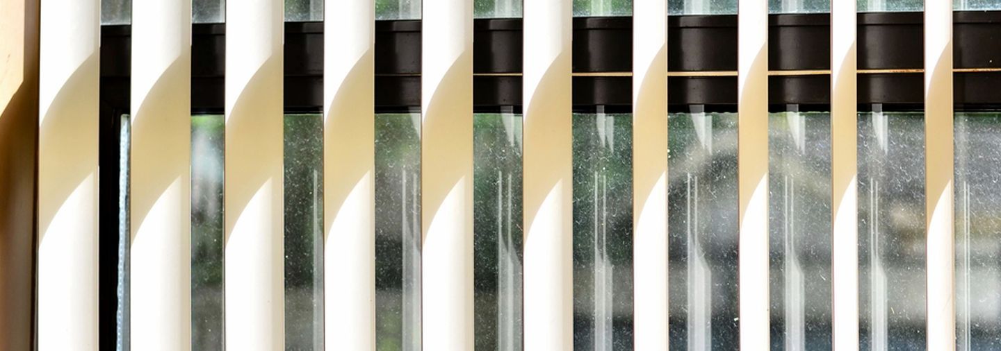 A Close Up Window With Blinds — Ron Ayton Curtains, Blinds & Shutters In Shelly Beach, NSW