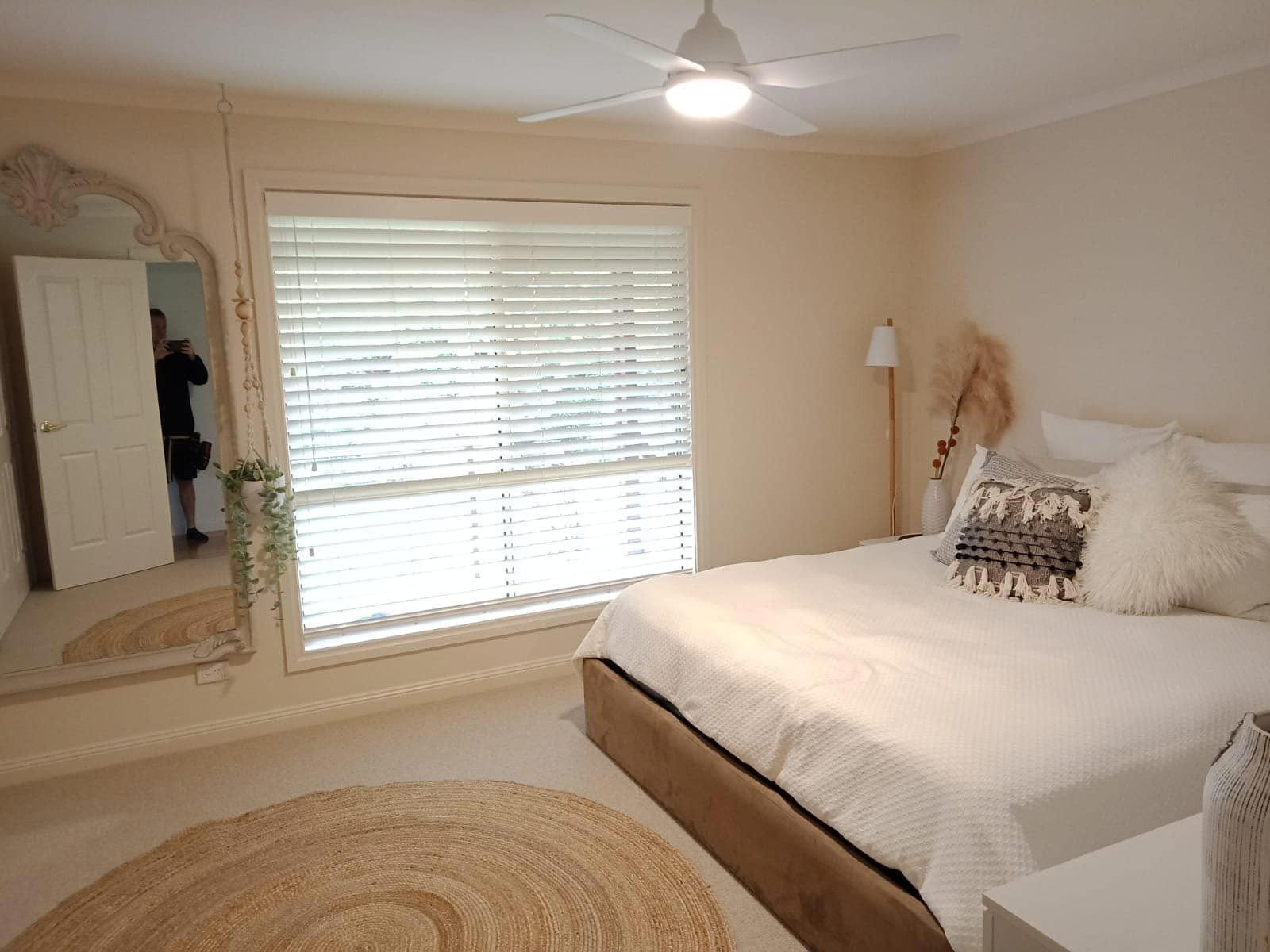 White Venetian Blinds On The Bedroom