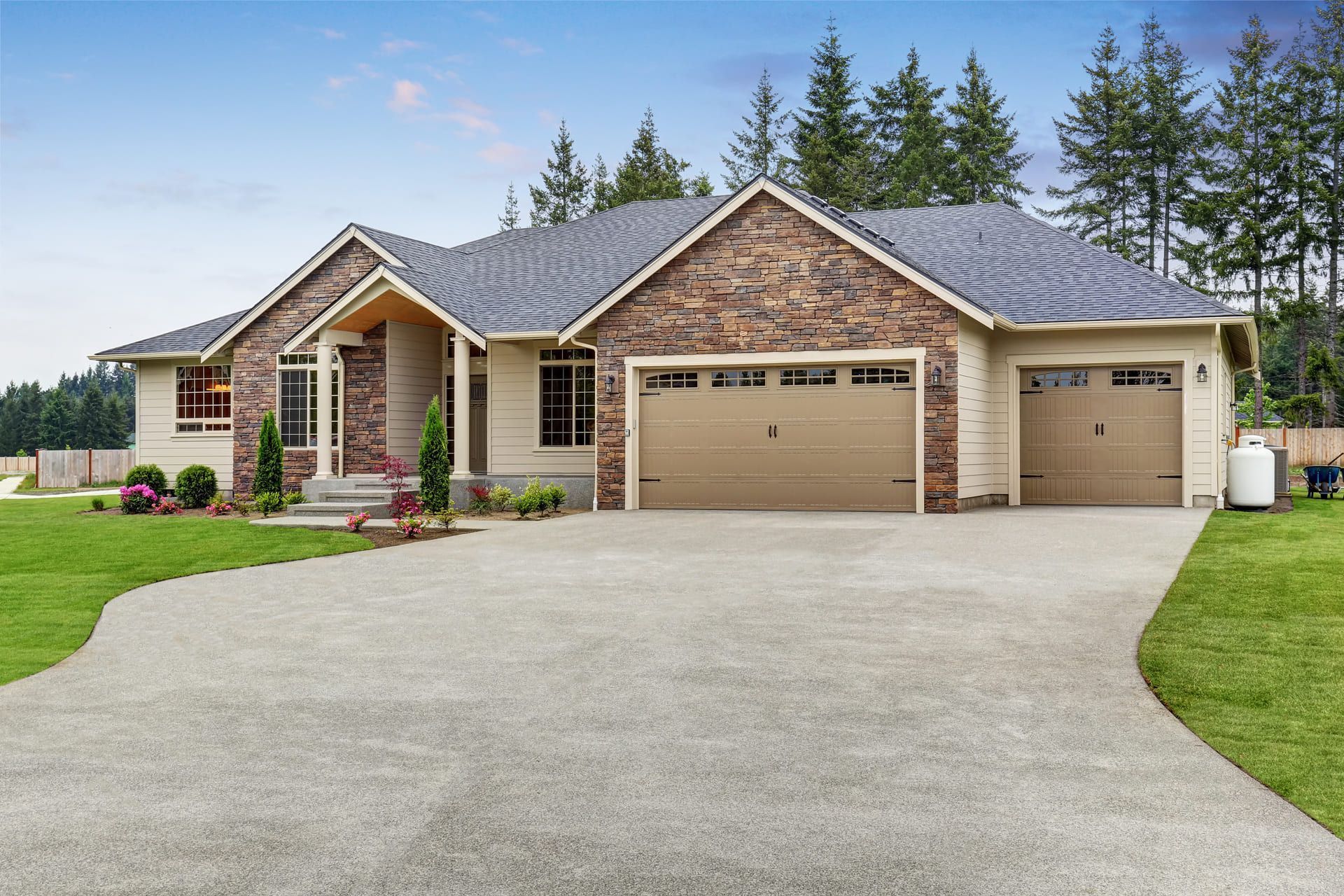 Luxury one level house exterior with brick trim and garage