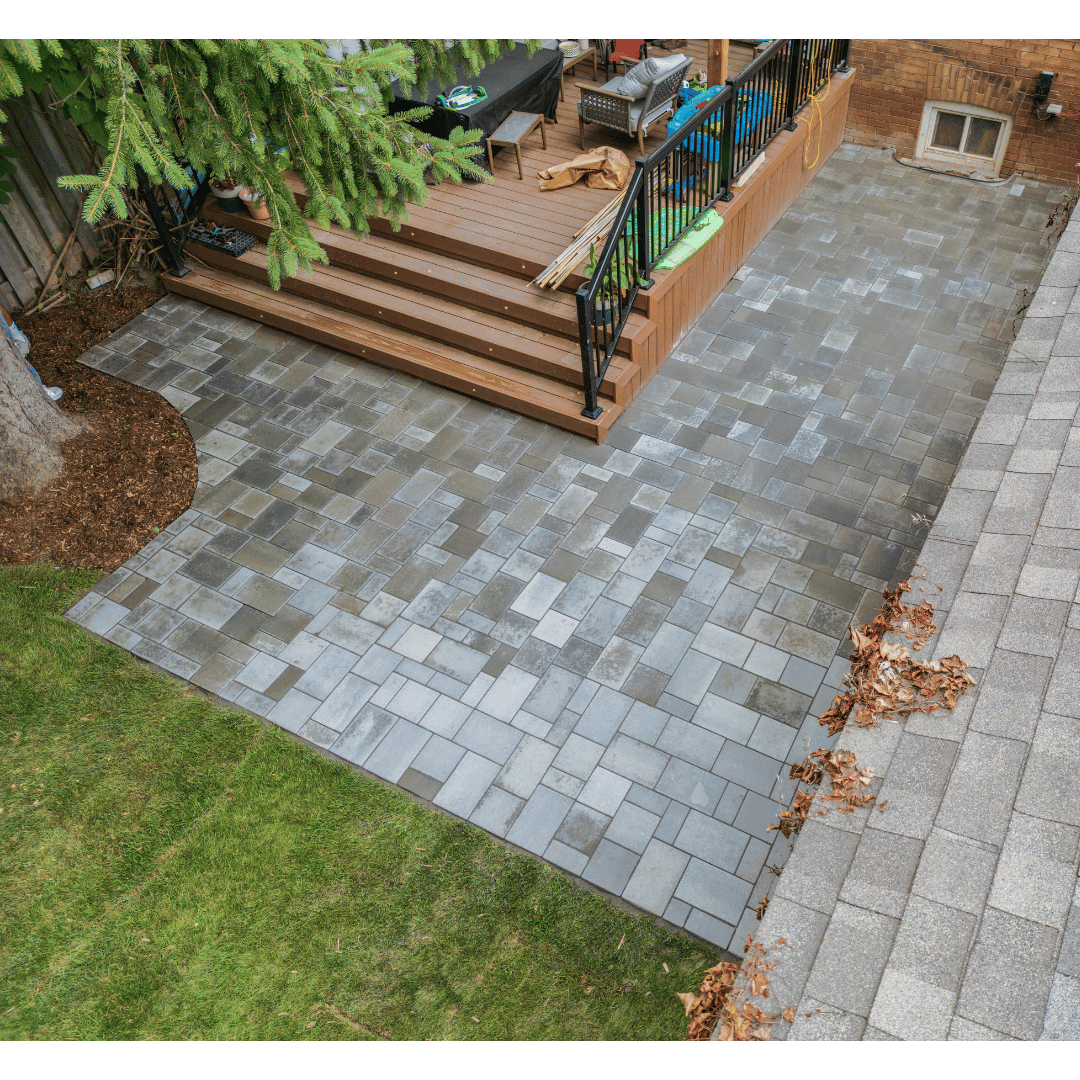 An aerial view of a patio with stairs and a deck.