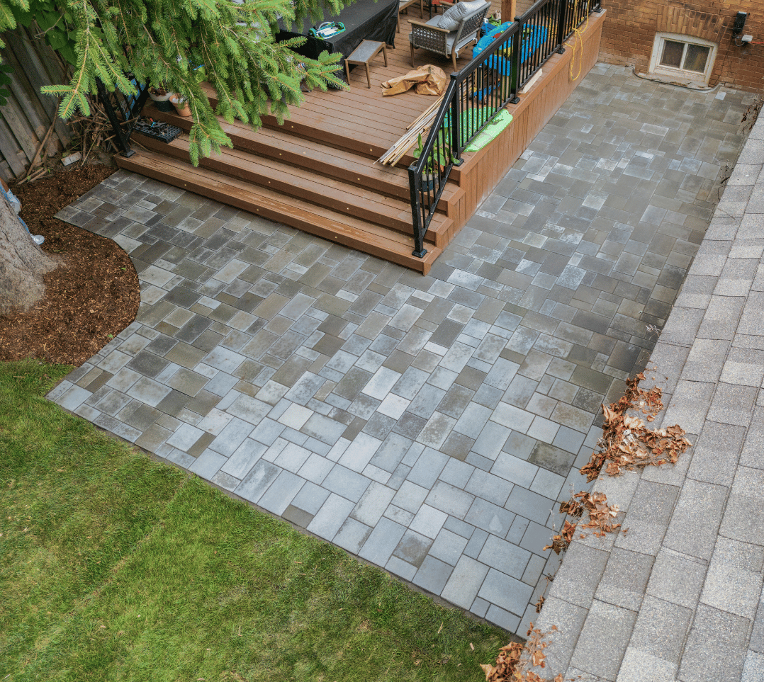 An aerial view of a patio with a deck and stairs.