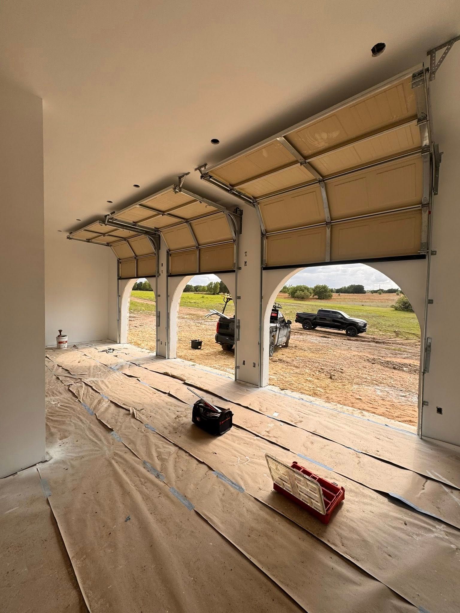 beautiful arched entry 3 car garage with new doors